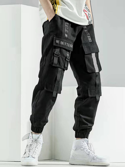 Manfinity EMRG Men Slogan Graphic Buckle Detail Flap Pocket Drawstring Waist Cargo Pants, Street Wear Long Black Pants, for Husband, Boyfriend Gifts, Black Cargo Pants Men, Multi Pocket Cargo Pants Men, Baggy Cargo Pants, Streetwear Cargo Pants